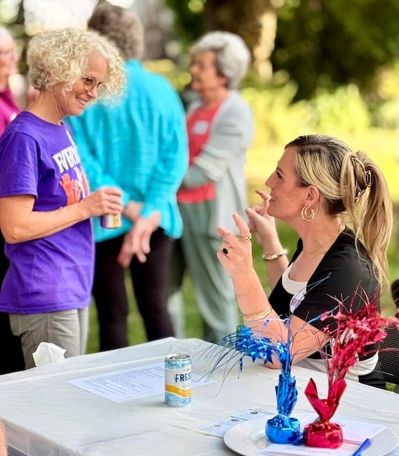 Kaylee Peterson (right) talking with Molly at a Latah County Democrats event - 2026.